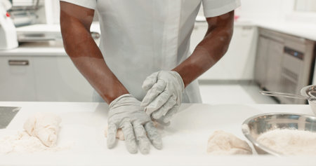 Cooking, bakery and dough with hands of person in kitchen for coffee shop, food industry and meal...
