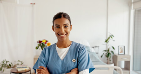 Woman portrait, nurse and arms crossed in hospital, medical expert and pride for healthcare service. Female person, surgeon professional and doctor for clinic consultation, physician and medicineの写真素材