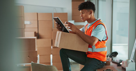 Man, tablet and reading with box at warehouse with scroll, inventory or check for supply chain job....
