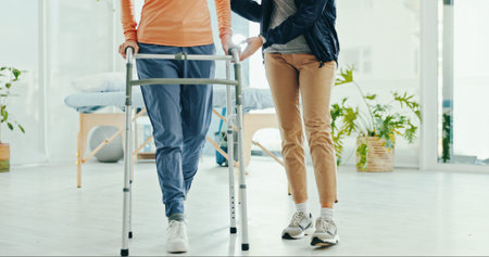 Legs, physiotherapy and walker for patient, help and support for recovery, steps or guide at...