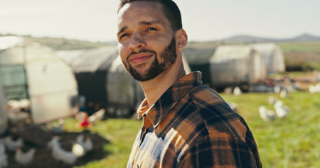 Man, farmer thinking and chicken for livestock farming, producing and distribution. Male person, business and smile as entrepreneur with ideas or vision for career, agriculture or poultry industryの写真素材