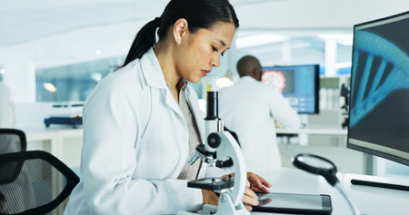 Scientist, woman and tablet in lab for dna sequence with medical research, test and solution at...