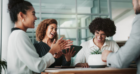 Business people, applause and meeting with group, startup and celebration with success for legal case in office. Men, women and tablet with announcement, achievement and happy with deal at law firmの写真素材