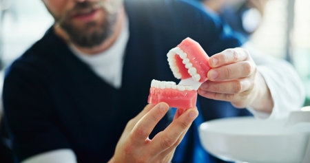 Man, hands and dentist with mouth mold for dental hygiene, healthcare or surgery consultation at...