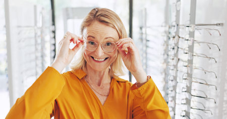 Glasses, portrait and optometry with woman and choice for eye care, healthcare and store. Shopping, lens check and frame with female customer in clinic for ophthalmologist, vision and prescriptionの写真素材