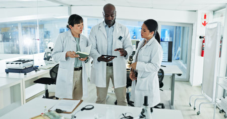 Science, people and tablet in lab for advice, brainstorming and innovation for medicine development. Scientists, research team and tech in facility for learning, mentorship and planning in discussionの写真素材
