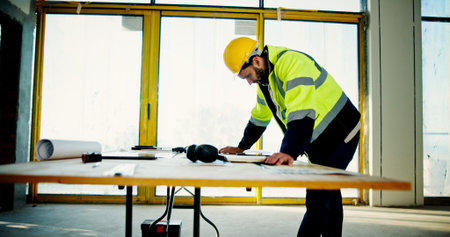 Architecture, inspection and blueprint with man on construction site for building, real estate and...