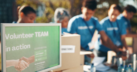 Charity, information and sign with volunteer group outdoor in park for community food drive or donation. Action, activism and poster with society or welfare workers together for NGO or non profitの写真素材