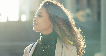 Commuting, thinking and woman in city, travel and journey for work, confident and outdoor in morning. Trip, contemplating and professional with ideas for journalism, road and opportunity for personの写真素材