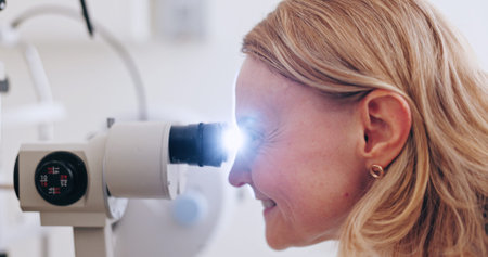 Eye exam, ophthalmology and woman in clinic for healthcare, vision test and slit lamp machine....
