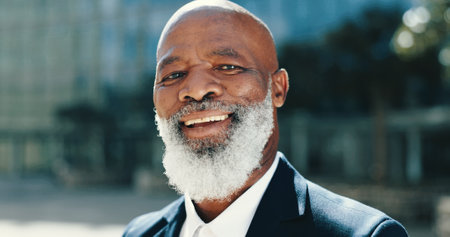 Smile, mature and portrait of business black man in city for lawyer, corporate and legal counsel. Professional, confidence and attorney with person in Kenya outdoors for commute, pride and advocateの写真素材