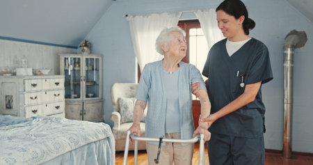 Nurse, support and walker with old woman with a disability for healthcare, caregiver and empathy. Retirement, gratitude and elderly care with people in nursing home for helping, volunteer and patientの写真素材