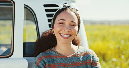 Road trip, woman and portrait with smile in field for holiday adventure, summer getaway or relax in countryside. Girl, happy or journey in meadow for nature scenery, sightseeing or break in Australiaの写真素材