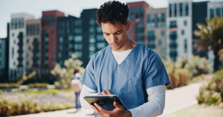 Man, nurse and research with tablet for internship, med school or online healthcare course at...