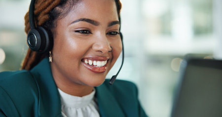 Customer service, call center and happy business woman for talking, online consulting and contact. Corporate office, computer and person with headset for communication, CRM support and telemarketingの写真素材