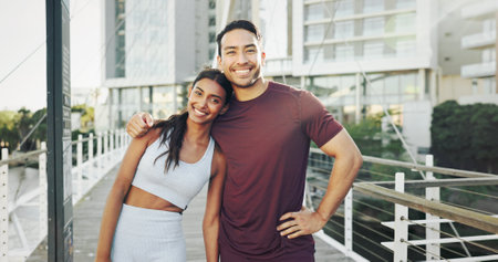 Portrait, city and couple with workout, exercise and smile for support and challenge in New York. Athlete, man and woman in urban town for health, wellness and training break for marathon enduranceの写真素材