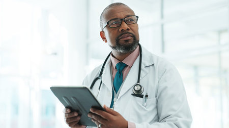 Black man, doctor and tablet for thinking in hospital with medical research, Telehealth and surgery...