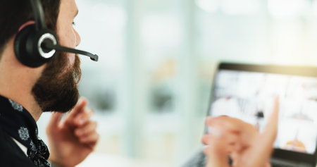 Video call, microphone and business man with laptop in office for planning, virtual conference and webinar. Communication, speaker and online meeting with person in agency for feedback and networkingの写真素材