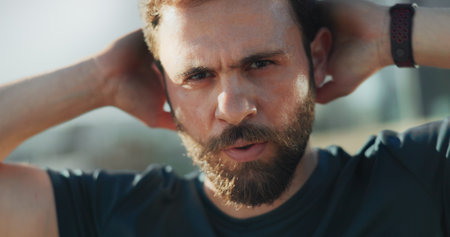 Fitness, man and portrait in city with rest, break and determination for workout progress. Face, athlete and tired in Puerto Rico with ambition, wellness and commitment for healthy body in challengeの写真素材