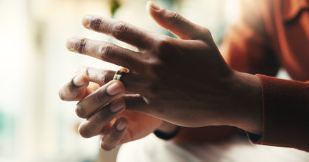 Hands, man and conflict as divorce, anxiety and stress for mental health, wellness and counselling. Male person, mistake and frustrated in psychology with depression, therapy and wedding ring in homeの写真素材