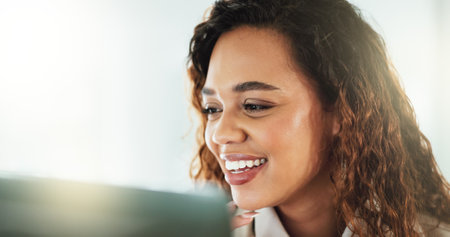 Face, laptop and smile with business woman in office for administration, report or research. Accounting, computer and profit with happy Brazilian bookkeeper in workplace for financial managementの写真素材