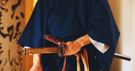 Japan, martial arts and hands of samurai with sword for self defense, combat or protection in battle. Sensei closeup, person and weapon in sheath for routine practice, cultural discipline or kenjutsuの写真素材