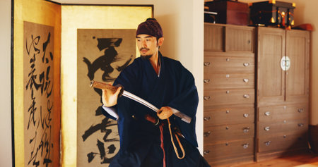 Kenjutsu, start and sword with Samurai man in Japan for combat, martial arts or training, Culture, dojo and weapon with Japanese person in kendogi for discipline, exercise or practice routineの写真素材