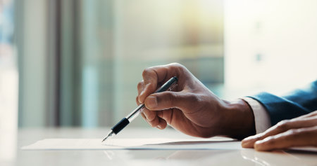 Business document, hands and signature in office for sign up agreement, application or policy information. Professional, person and legal paperwork for registration compliance or terms and conditionsの写真素材