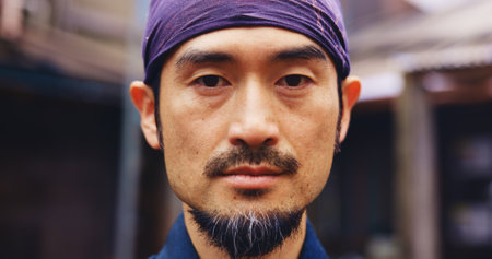Japanese sensei, martial arts and portrait of man with confidence, serious and determination. Asian person, face and warrior at dojo for jujutsu training, culture and master of traditional sportsの写真素材
