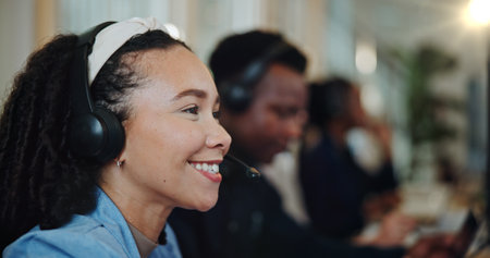Woman, happy and people in call center for customer support, telemarketing and lead generation. Agent, technology and consulting in coworking space for CRM, assistance and advice service at help deskの写真素材