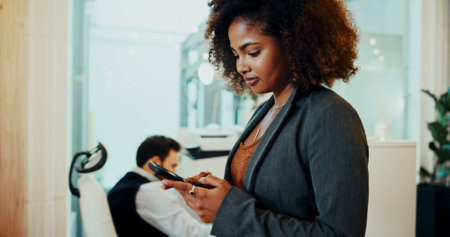 Business woman, phone text and office with professional on social media break with website scroll. Internet, online and mobile networking with career consultant and connection on email app at workの写真素材