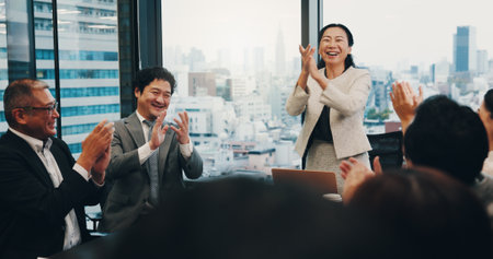 Celebration, applause and people in meeting, boardroom and clapping for achievement, teamwork or cheering. Office, boss and success for accomplishment, investor and smile for business or joy in Japanの写真素材