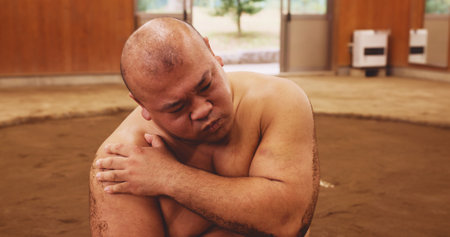 Man, wrestler and shoulder pain for sumo, fitness and exercise with injury, discomfort and tension. Male person, athlete and muscle inflammation for training, workout and sports with culture in Japanの写真素材