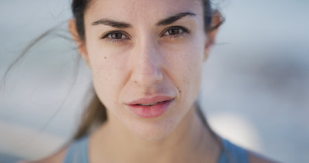 Serious, runner and fitness with portrait of woman for workout break, ready and marathon training. Health, exercise and start with female person and outdoor for wellness, sports and running.の写真素材