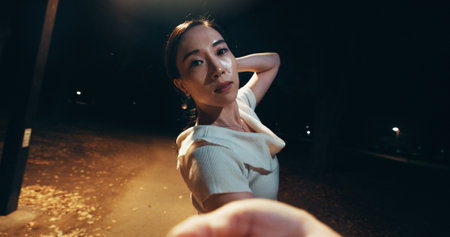 Japanese woman, selfie and outdoor with portrait, confidence and style as professional dancer. Female person, city street and photography for fashion, pride and edgy as performance artist at nightの写真素材