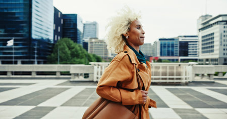 Rush, businesswoman and running in the city for travel, commute and late for corporate meeting outdoor. Urban, female person and worker in hurry for appointment, project deal and journey to workplaceの写真素材