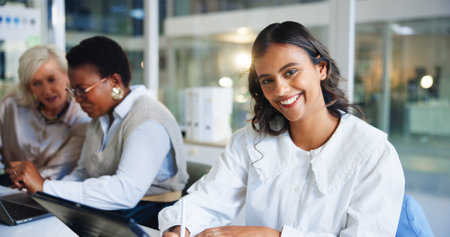 Portrait, business and women in meeting, smile and happiness with teamwork, app and journalist. Person, copywriting and magazine editor with research for article, schedule or technology in officeの写真素材