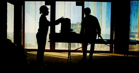Teamwork, silhouette or people on construction site for engineering project or property management. Architecture maintenance, dawn or contractors in dark for building renovation or safety developmentの写真素材