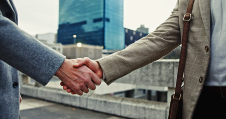 Business, people and handshake for success in city with partnership, introduction and agreement...