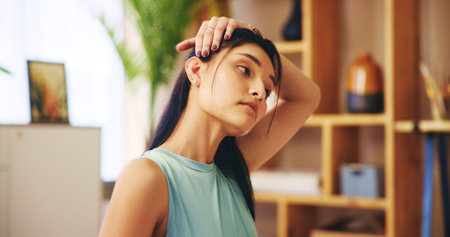 Stretching, neck and woman with exercise routine for calm, strong muscle and mental health. Female person, training and healthy in home for posture, relief and fitness as pilates workout or practiceの写真素材