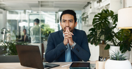 Business, laptop and man with thinking of decision in office with problem solving, financial solution and planning. Finance firm, auditor or thoughtful at desk for risk management, ideas or strategyの写真素材