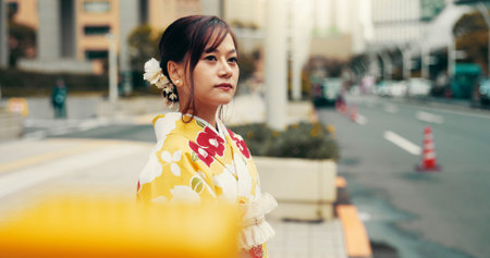 Crosswalk, kimono and travel with Japanese woman in city for heritage, festival ceremony and...