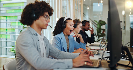 Call center, woman and tired in office as customer service professional for sales agent in company. Female person, headset and consultant in telemarketing agency with yawn, fatigue or burnout at workの写真素材