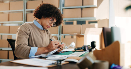 Man, writing and paperwork for distribution industry, inventory update and logistics information....