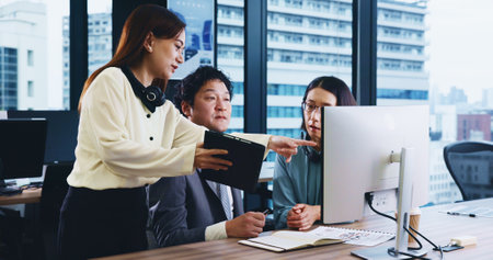 Computer, teamwork and business people in meeting, tablet and internet with research for stock market. Employees, coworkers and leader in office, documents and tech with accounting, planning or Japanの写真素材