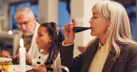 Grandparents, celebration and thanksgiving dinner with wine, festive holiday and food for vacation....