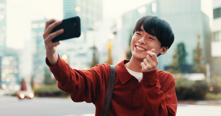 Japanese man, selfie and smile in street for social media, post or memory as university student....