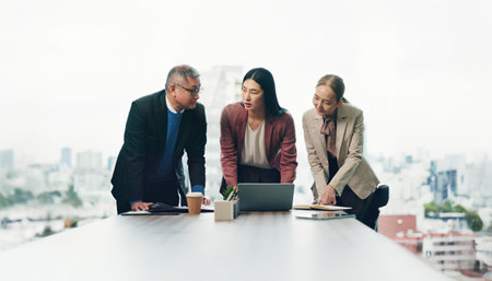 Japan, laptop and business people in meeting, teamwork and conversation with connection. Employees,...