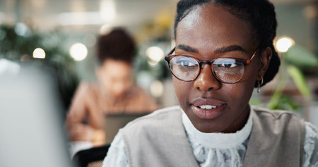 Glasses, computer and reading with business woman in office for planning, website and email. Company...