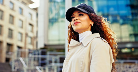 Commuting, road and woman in city, travel and journey for work, thinking or confident in morning. Trip, contemplating and journalist with ideas in New Jersey, street or opportunity for fashion criticの写真素材